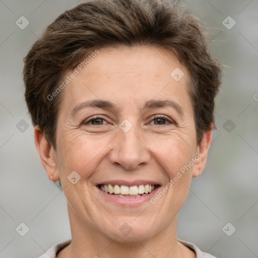 Joyful white adult female with short  brown hair and brown eyes