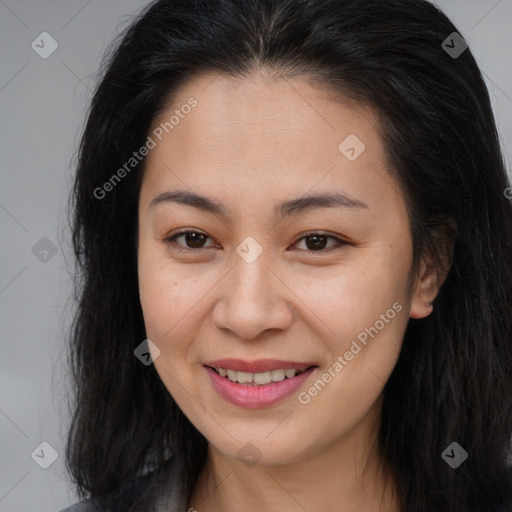 Joyful asian young-adult female with long  brown hair and brown eyes