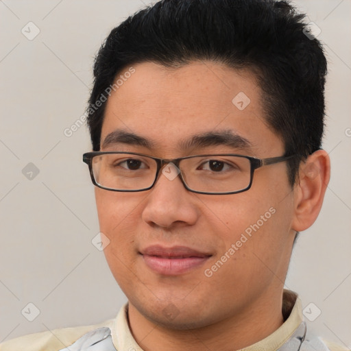 Joyful asian young-adult male with short  brown hair and brown eyes