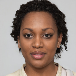 Joyful black young-adult female with medium  brown hair and brown eyes