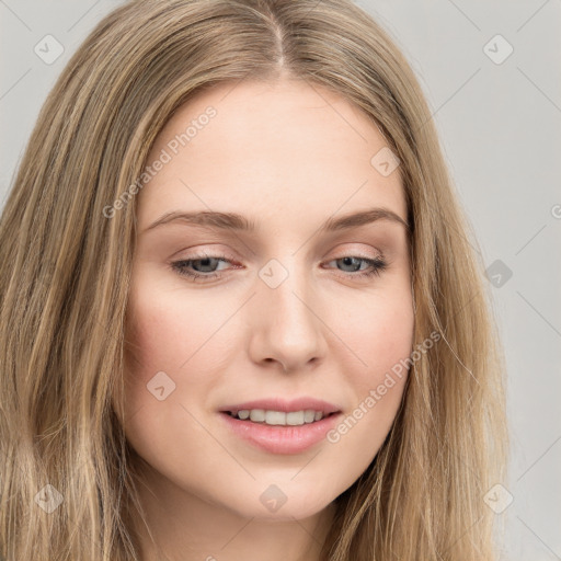 Joyful white young-adult female with long  brown hair and green eyes