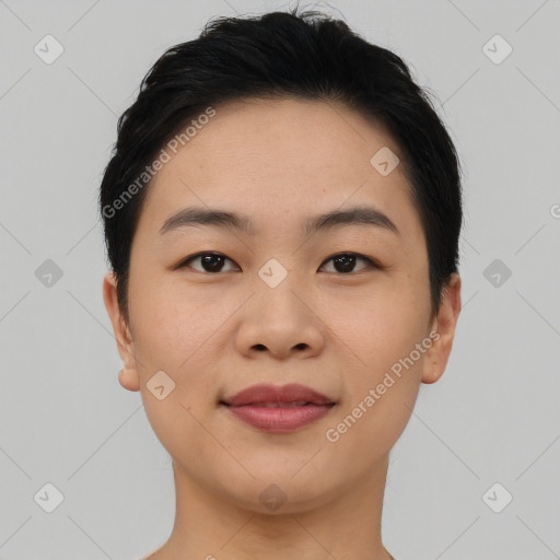 Joyful asian young-adult female with short  black hair and brown eyes