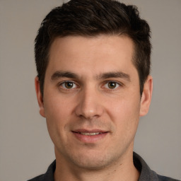 Joyful white young-adult male with short  brown hair and brown eyes