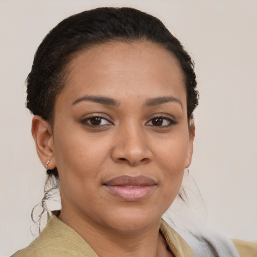 Joyful latino young-adult female with short  brown hair and brown eyes