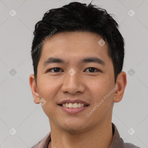 Joyful white young-adult male with short  black hair and brown eyes