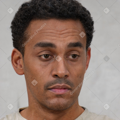 Neutral latino young-adult male with short  brown hair and brown eyes