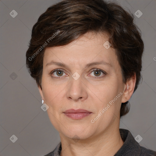 Joyful white adult female with medium  brown hair and grey eyes