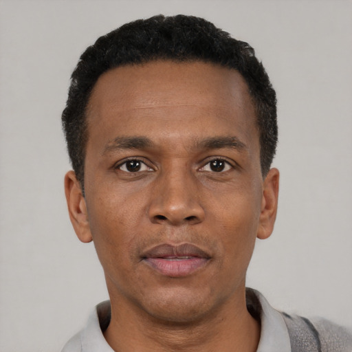 Neutral black young-adult male with short  black hair and brown eyes