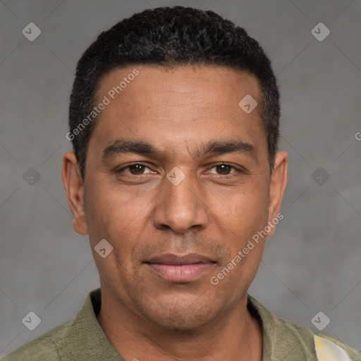 Joyful white adult male with short  black hair and brown eyes