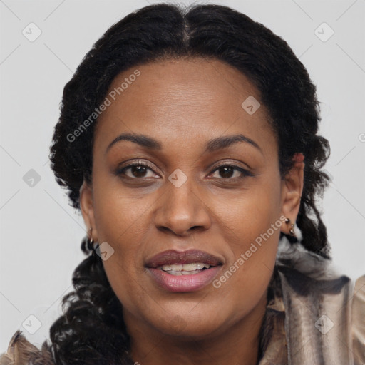 Joyful black young-adult female with long  brown hair and brown eyes