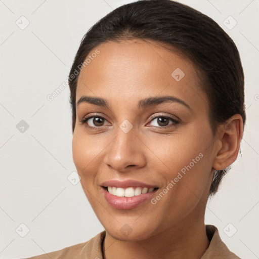 Joyful white young-adult female with long  brown hair and brown eyes