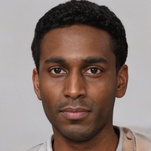 Neutral black young-adult male with short  black hair and brown eyes