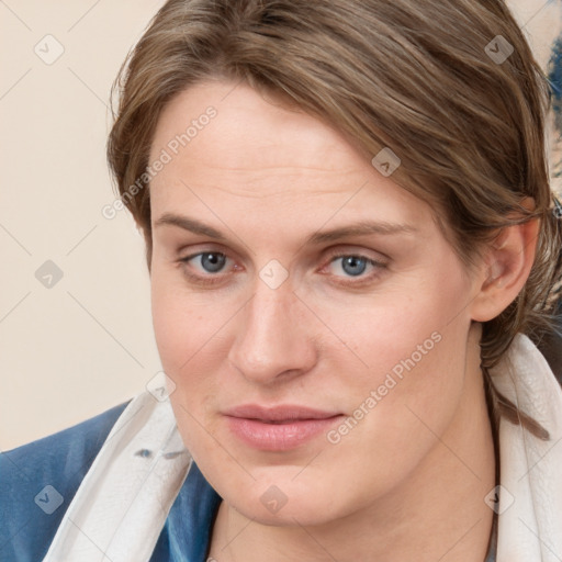 Joyful white young-adult female with medium  brown hair and blue eyes