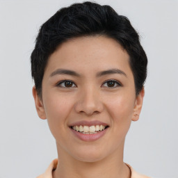 Joyful asian young-adult female with short  brown hair and brown eyes