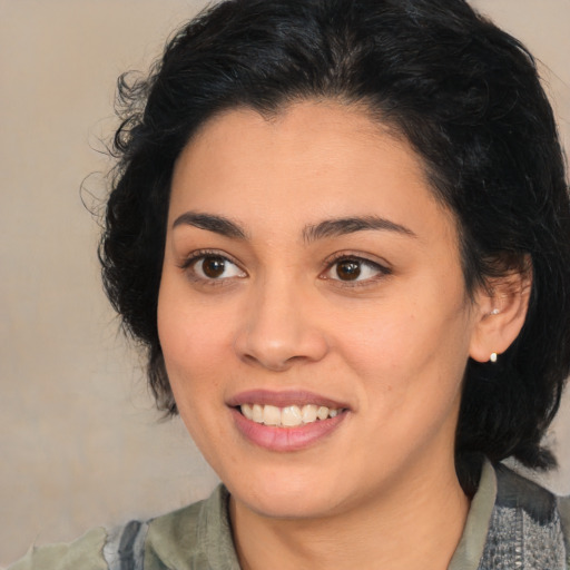 Joyful latino young-adult female with medium  black hair and brown eyes