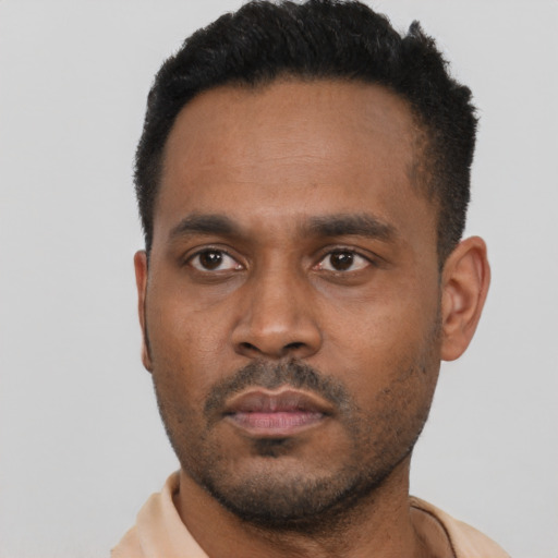 Neutral latino young-adult male with short  black hair and brown eyes