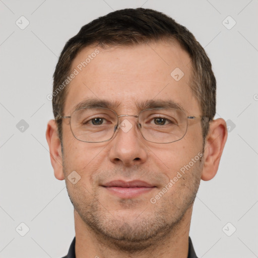 Joyful white adult male with short  brown hair and brown eyes