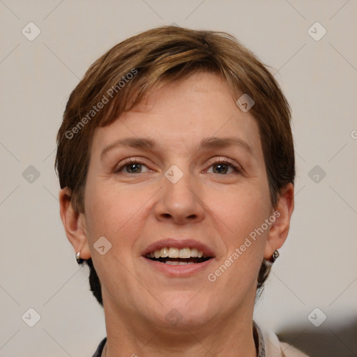 Joyful white adult female with short  brown hair and grey eyes