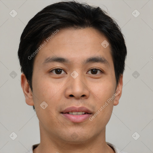 Joyful asian young-adult male with short  brown hair and brown eyes