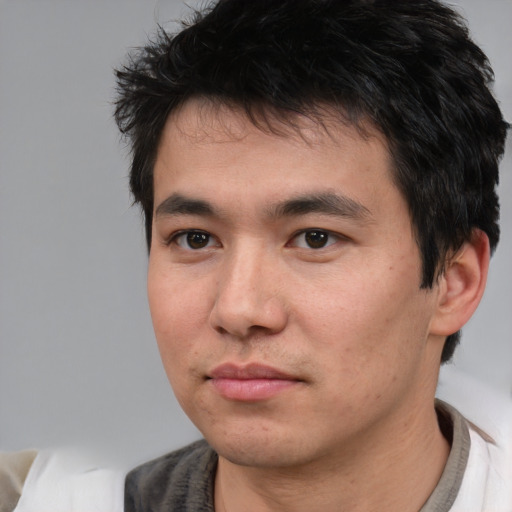Neutral white young-adult male with short  black hair and brown eyes