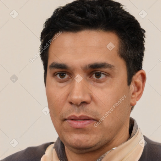 Neutral latino young-adult male with short  black hair and brown eyes