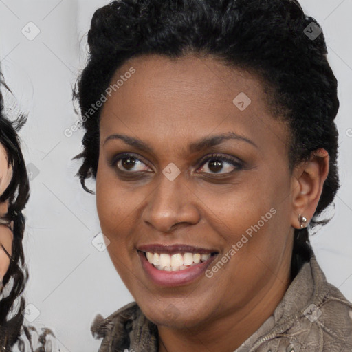 Joyful black young-adult female with medium  brown hair and brown eyes