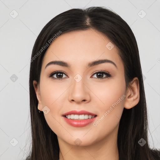 Joyful white young-adult female with long  black hair and brown eyes