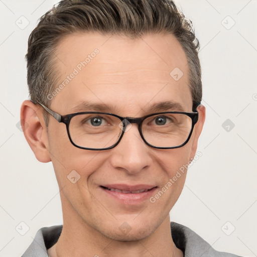 Joyful white adult male with short  brown hair and grey eyes