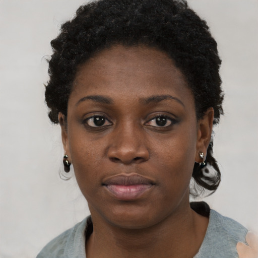Neutral black young-adult female with short  black hair and brown eyes