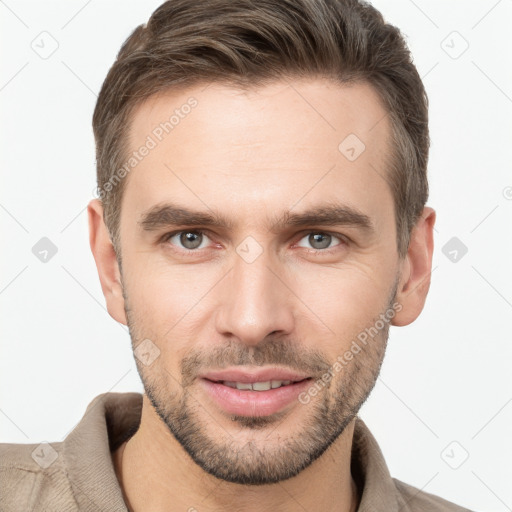 Joyful white young-adult male with short  brown hair and brown eyes