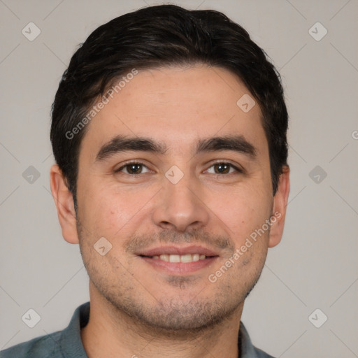 Joyful white young-adult male with short  black hair and brown eyes