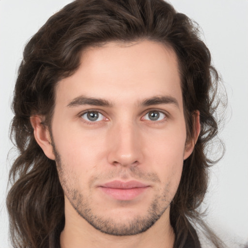 Neutral white young-adult male with medium  brown hair and brown eyes