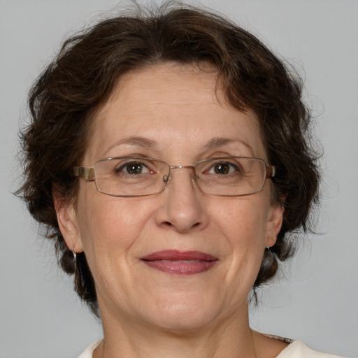 Joyful white middle-aged female with medium  brown hair and green eyes