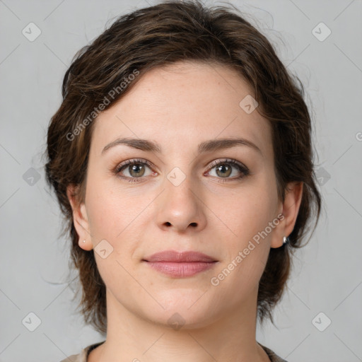 Joyful white young-adult female with medium  brown hair and green eyes