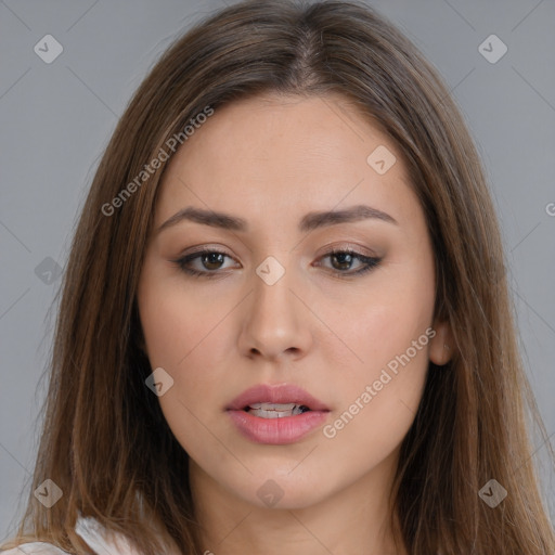 Neutral white young-adult female with long  brown hair and brown eyes