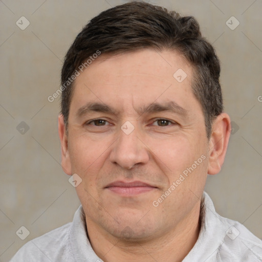 Joyful white adult male with short  brown hair and brown eyes