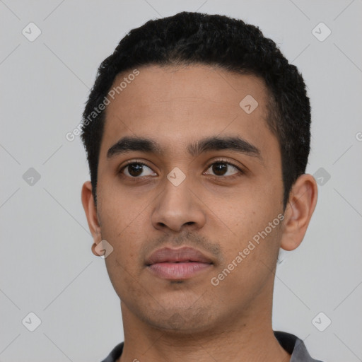 Neutral latino young-adult male with short  black hair and brown eyes