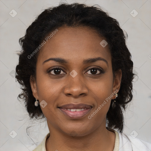 Joyful black young-adult female with long  brown hair and brown eyes