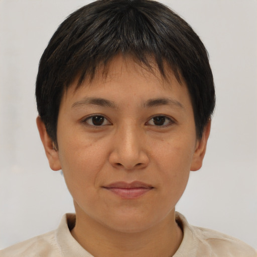Joyful asian young-adult female with short  brown hair and brown eyes