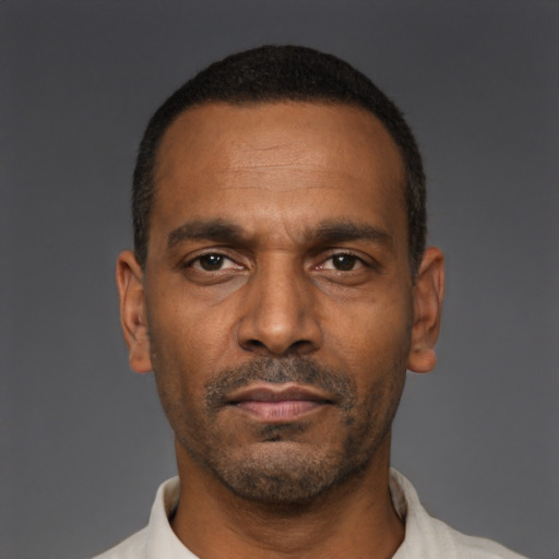Neutral black adult male with short  black hair and brown eyes