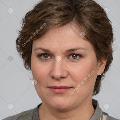 Joyful white adult female with medium  brown hair and grey eyes