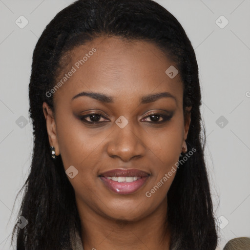 Joyful black young-adult female with long  black hair and brown eyes