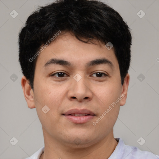 Joyful asian young-adult male with short  brown hair and brown eyes