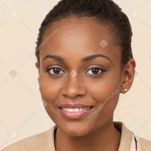 Joyful black young-adult female with short  brown hair and brown eyes