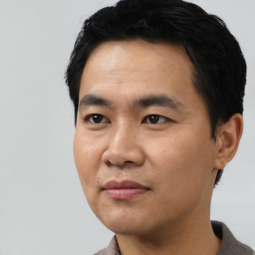Neutral asian young-adult male with short  black hair and brown eyes