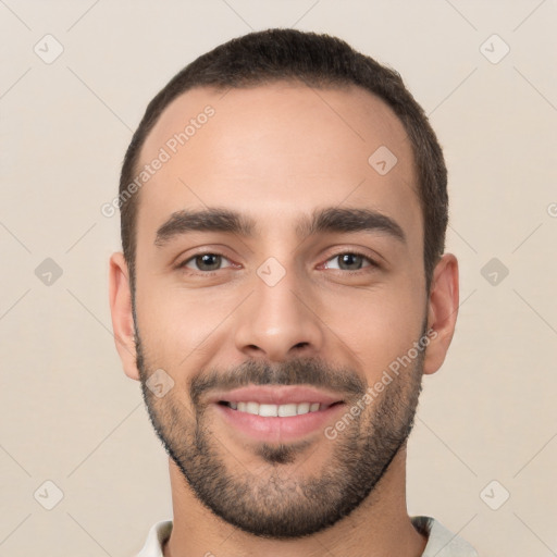 Joyful white young-adult male with short  black hair and brown eyes