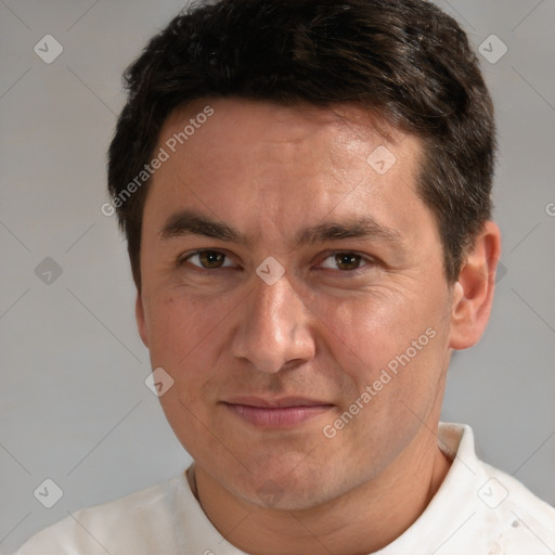 Joyful white adult male with short  brown hair and brown eyes