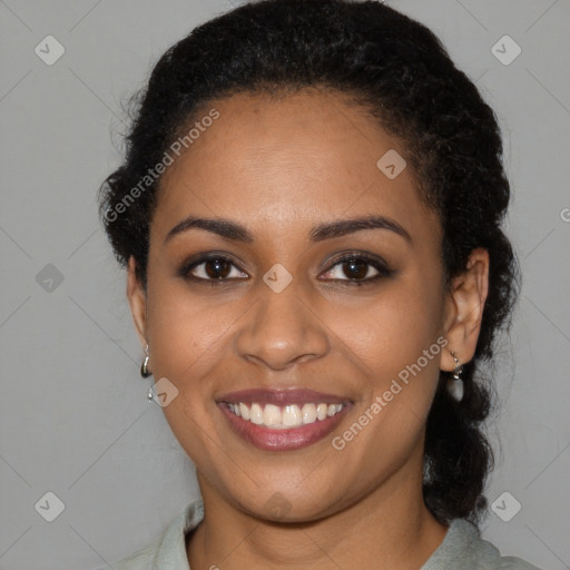 Joyful black young-adult female with medium  black hair and brown eyes