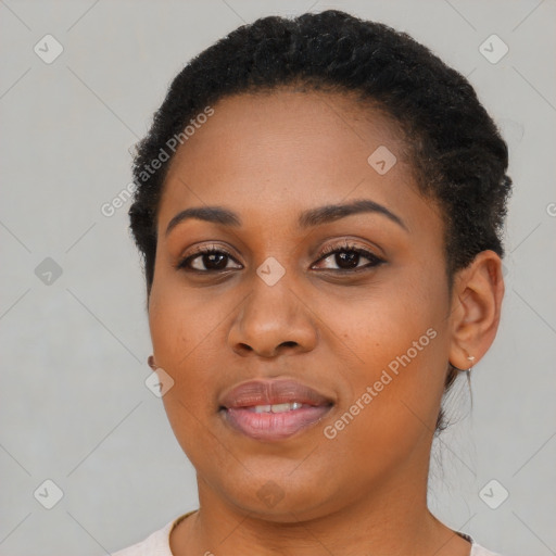 Joyful black young-adult female with short  brown hair and brown eyes