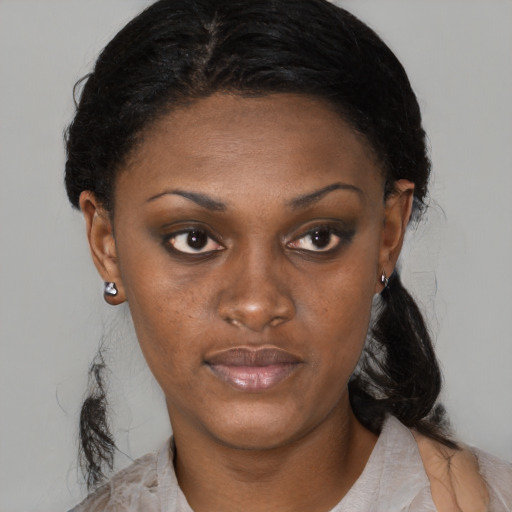 Neutral black young-adult female with medium  black hair and brown eyes